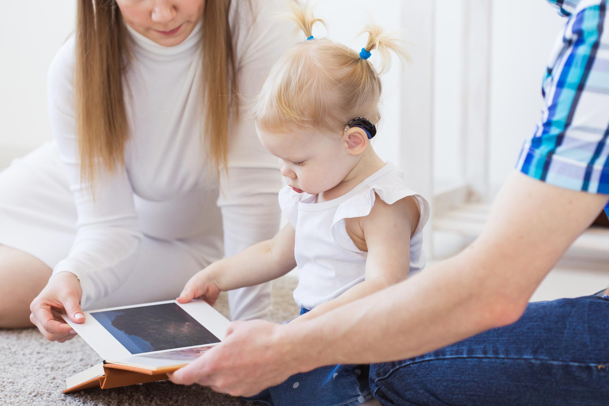 baby-girl-wearing-hearing-aid-disabled-child-disability-deafness-concept baby-girl-wearing-hearing-aid-disabled-child-disability-deafness-concept